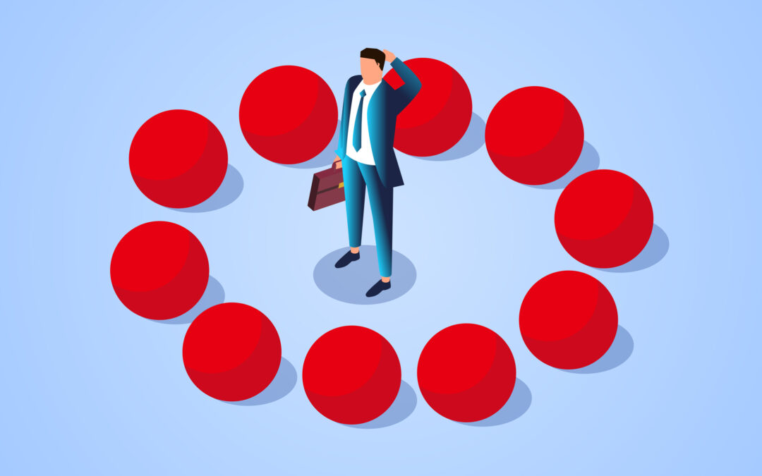 puzzled man surrounded by ten large red balls