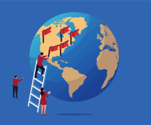 man on ladder next to giant globe placing fifth flag on a US city